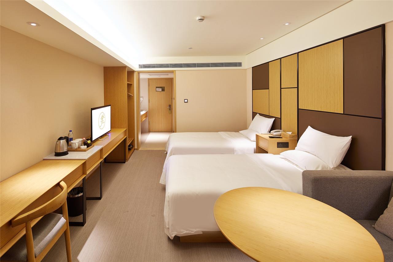 เจไอ โฮเทล ฮาร์บิน เวสต์ เรลเวย์สเตชั่น ว่านต้าพลาซา Hotel ภายนอก รูปภาพ